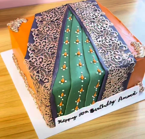 Custom birthday cake designed to resemble an elegant green and purple saree